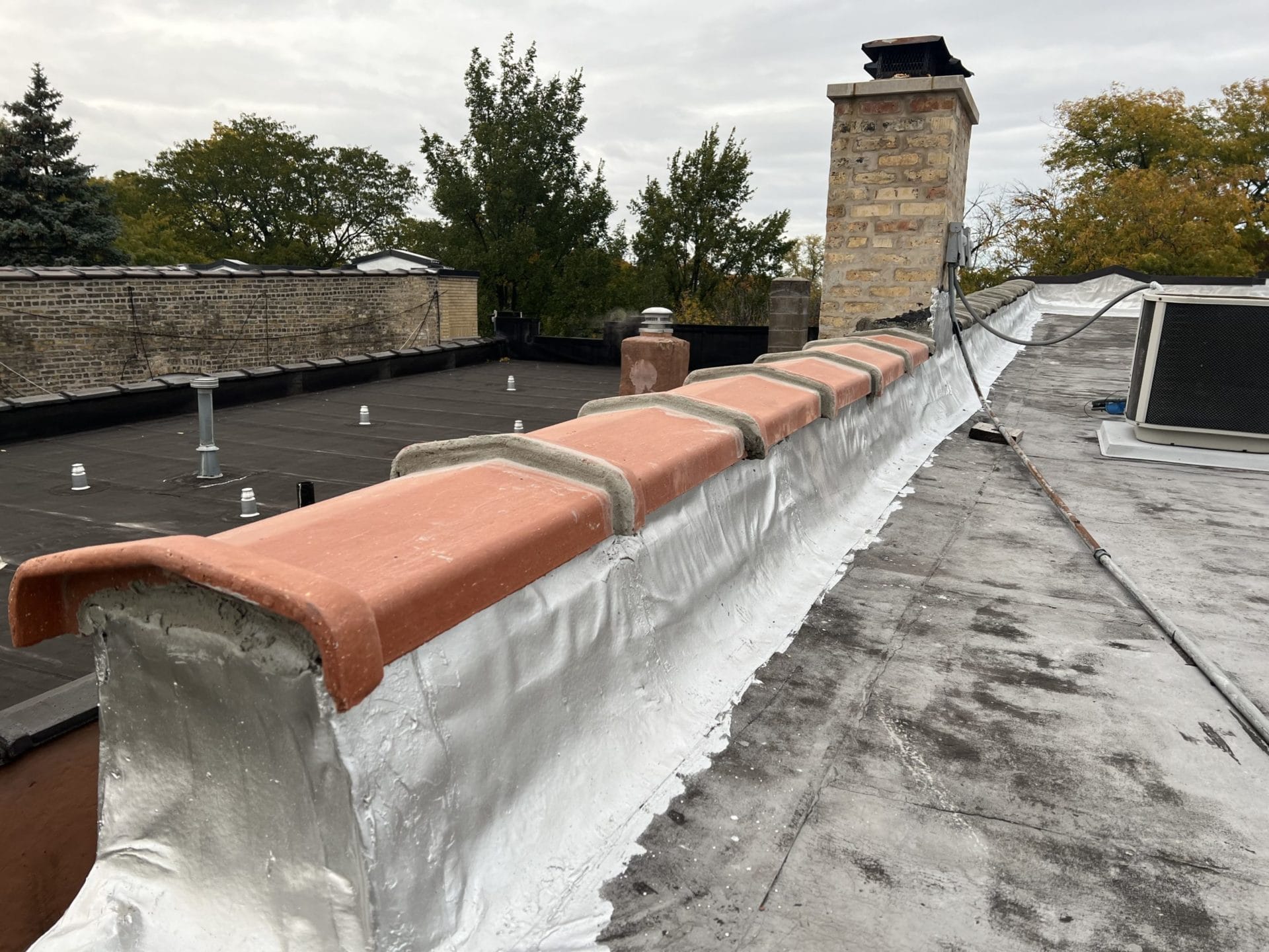 Parapet wall roof coping cap services installation and repair - Metal roof coping